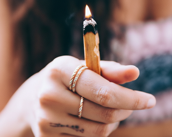 Two braided tri-metal rings stacked on forefinger